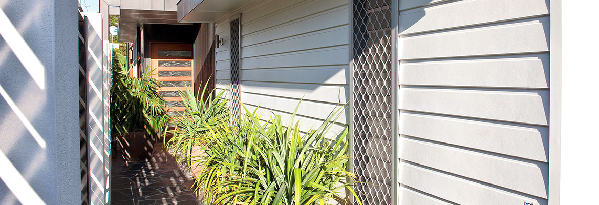 Diamond security window screens installed on a home